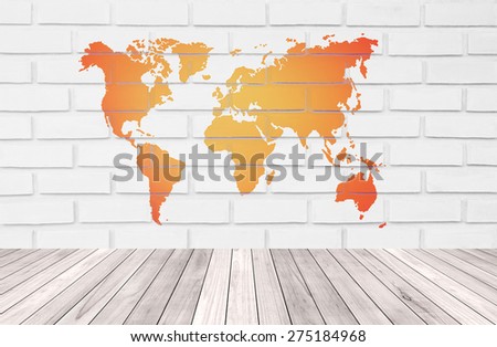 Pale orange continents map on white bleached brick wall witn perspective small wood strip