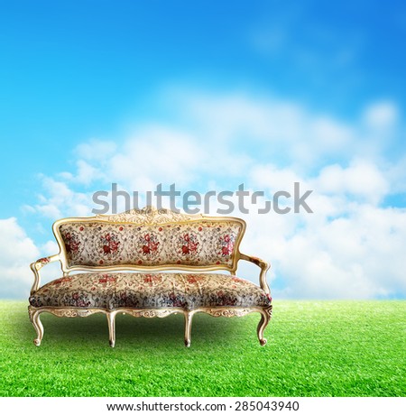 Long sofa vintage European style green grass field outdoor