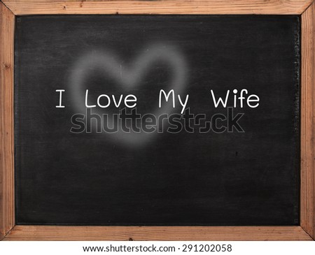 Bible love concept applicable on I Love My Wife rylics over wooden frame blackboard wooden