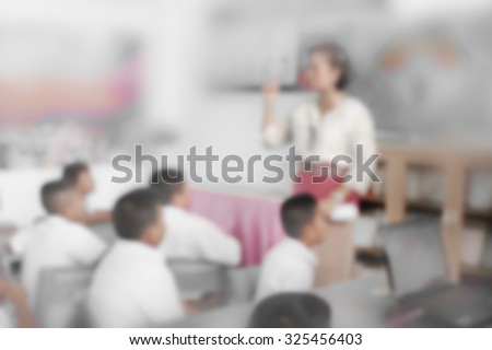 Blur schoolboys sitting in front of classroom listening for lecture and school project home work