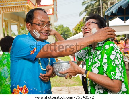 THAILAND - APRIL 13: Thai people celebrate Songkran (new year / water festival) by giving water to each other on April 13, 2011 in Nakhonratchasima, Thailand.