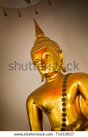 Gold Buddha statue in half body at the temple in Thailand.