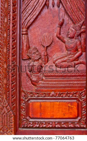 wood carving decorated at windows of the temple tells story about Lord Buddha, hand made by Thai artisan, Khonkaen,Thailand