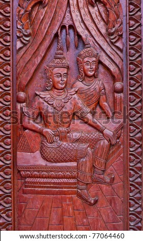 wood carving decorated at windows of the temple tells story about Lord Buddha, hand made by Thai artisan, Khonkaen,Thailand