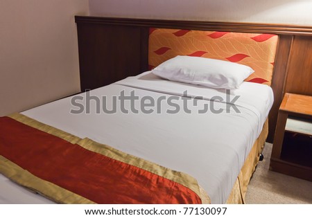 bed in room with dim light