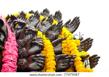 Many cast bronze hands of god Ganesha with yellow garland,Wat Samarn,Chacheangsoa,Thailand.
