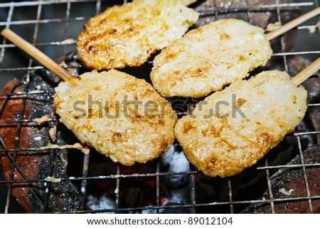 stick rice barbecue as fast food on hot stove,Loei,Thailand