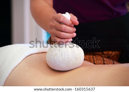 massage with spa herbal compress balls