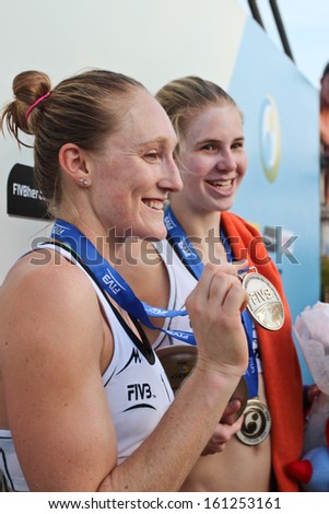 PHUKET, THAILAND - NOVEMBER 3: Emily Day and Summer Ross of America  celebrate silver medal win at the SWATCH FIVB World Tour 2013 on November 3, 2013 at Karon Beach in Phuket, Thailand