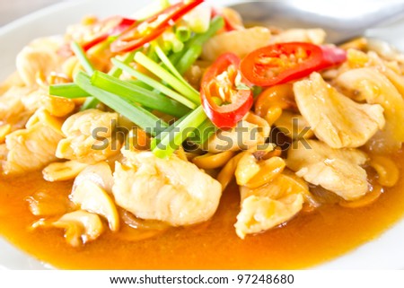 Stir fry chicken and chili in oil