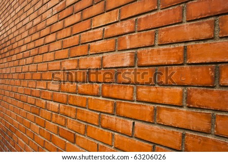 Wall brown brick walls of the unusual perspective for a background.
