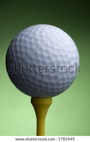 Isolated golf ball and tee close up