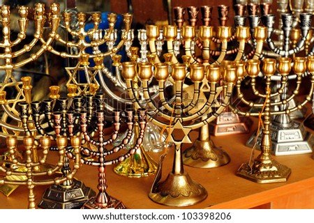 Menorah for sale in shop in the Jerusalem old city market. Hanukkah Jewish holiday is observed for eight nights and days.