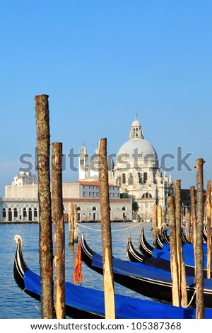 Campo della Salute church with Venetian Gondolas in the foreground in Venice, Italy.