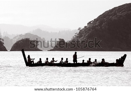 A traditional New Zealand Maori waka boat on the sea in the Bay of islands, New Zealand.
