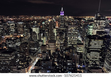 NEW YORK CITY OCTOBER 13 Aerial view on Manhattan and Empire State Building at night on October 13 2009 in New York The building is a 102-story landmark and American cultural icon in NYC NEW YORK CITY OCTOBER 13 Aerial view on Manhattan and Empire State Building at night on October 13 2009 in New York The building is a 102-story landmark and American cultural icon in NYC
