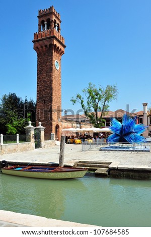 MURANO ISLAND - MAY 01: The clock tower in Murano island on May 01 2011. The clock tower is 19th Century clock tower and one of the most visited spots in the island.