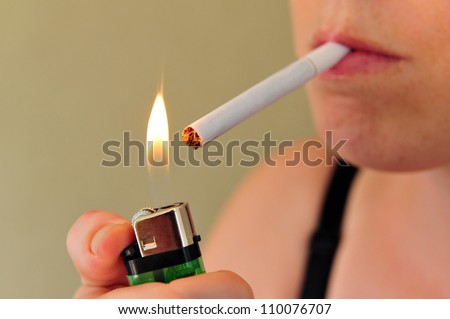 Concept photo of a woman smoking a cigarette.
