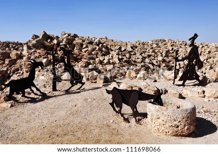Farm animals and human statues in the Negev desert, En Avdat National Park, Israel