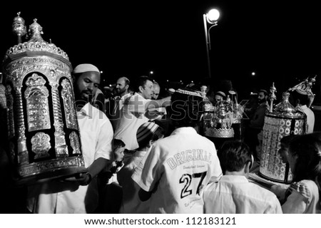 SDEROT - OCTOBER 14:Orthodox Jewish Men celebrate Simchat Torah on Oct 14 2006 in Sderot, Israel. Simchat Torah is a celebratory Jewish holiday marks the completion of the annual Torah reading cycle