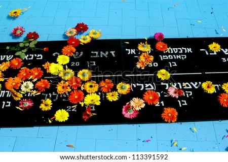 JERUSALEM - APRIL 23:Flowers over the names of the victims of the Israeli navy during the Memorial Day or Yom Hazikaron at the Memorial Service on Mount Herzl in Jerusalem Monday, April 23, 2007