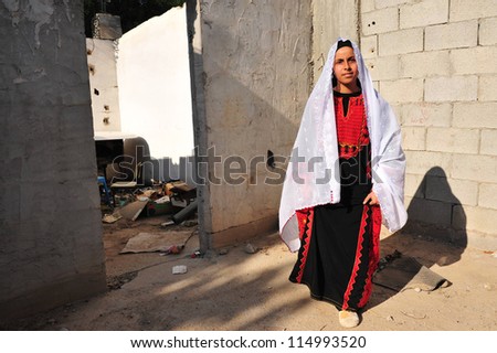 WESTERN NEGEV - NOVEMBER 26:Bedouin woman  traditionally dressed on November 26 2008. The nomadic Arabs live by rearing livestock in the deserts of southern Israel.