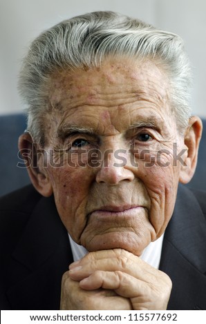 Portrait of happy old man in his 90\'s.  isolated on white background. Concept photo of senior citizen, retirement, pensioner, health and aging.