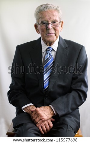Portrait of happy old man wearing a suit in his 90\'s.