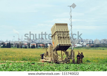 ASHKELON-APRIL 14:Israeli soldier near Iron Dome that  deployed on April 14 2011 in Ashkelon,Israel.The $200 million anti-rocket system was created by Israel against rocket attacks from the Gaza strip