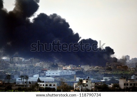 GAZA STRIP - JANUARY 09: Big black smoke over Gaza Strip during Cast Lead operation on January 09 2009.It was a three-week armed conflict in the Gaza Strip during the winter of 2008-2009.