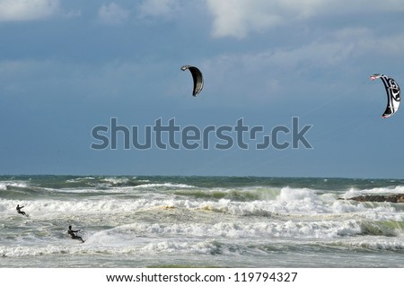 ASHKELON - March 09: Kitesurfer is kite boarding on March 09 2011 in Ashkelon, Israel.In 2012, the number of kitesurfers estimated to 1.5 million persons world wide.
