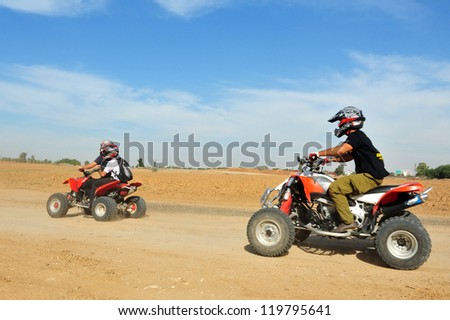 WESTERN NEGEV - NOVEMBER 06:An ATV riders on a  Quad bike on November 06 2010 in the  Western Negev , Israel. Off road vehicles were first made available in the early 1960s.
