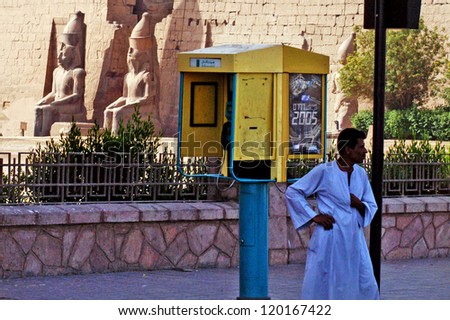 LUXOR - MAY 02:An Egyptian payphone outside Luxor Temple in Luxor, Egypt on May 02 2007.Payphone revenues have sharply declined in many places, largely due to the increased usage of mobile phones.
