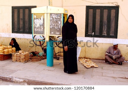 ASWAN - APRIL 28: Muslim women dressing Hijab in Aswan market, Egypt on April 28 2007.The meaning of the Muslim dressing cod is modesty, privacy, and morality.