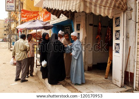 ASWAN - APRIL 28: An Egyptian man selling fresh meat in Aswan market, Egypt on April 28 2007.Egypt\'s total agricultural crop production has increased by more than 20 percent in the past decade.
