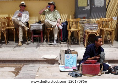 ASWAN - APRIL 28:Western visitor sits in a cafe in Aswan,Egypt on April 28 2007.The number of tourists visiting Egypt dropped by more than a third since the Egyptian revolution on Jan 25 2011.