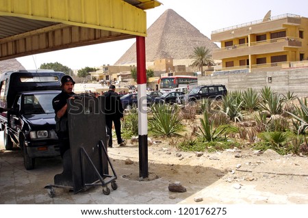 GIZA - APRIL 27: Egyptian security forces guard the entrance to the pyramids at the great pyramids in Giza, Egypt on April 27 2007.Since the 90\'s tourist became a target by Muslim militant in Egypt