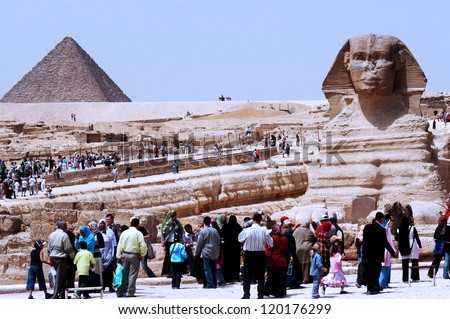 GIZA - APRIL 27: Visitors under the Sphinx of Giza, Egypt on April 27 2007 .It\'s the largest and most famous sphinx is the world.