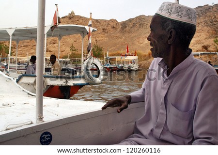 ASWAN - APRIL 29:An Egyptian Nubian man on a boat on Aswan lower dam, Egypt on April 29 2007.It was intended to reduce flooding and to support population growth in the lower Nile.