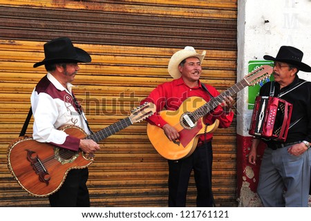 MEXICO CITY - FEB 28: Mariachi band play Mexican music at Xochimilco\'s Floating Gardens on February 28 2010 in Mexico City, Mexico. It\'s Mexican musical tradition that dates back to the 19th century