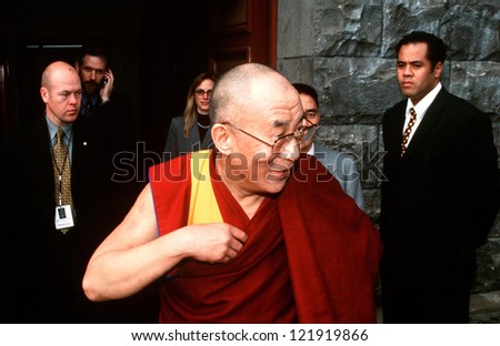AUCKLAND - APRIL 10 2003:14th Dalai Lama is surrounding by bodygourds while visiting in NZ in 2003.He has lived in exile in India since the Chinese Army crushed an uprising in his homeland in 1959.