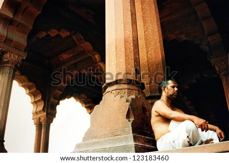 NEW DELHI - AUG 12:Indian man meditate on August 12 2004 at the Red Fort in New Delhi,India.Built between 1638-1648 BC by the Mughal emperor Shah Jahan as the royal residence in his new capital,Delhi