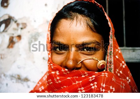JAIPUR - AUG 25: Rajasthani woman outside here home on August 25 2004 in Jaipur Rajasthan, India.In India, Dalit women experience high rates of sexual violence committed by Indian men of higher caste.