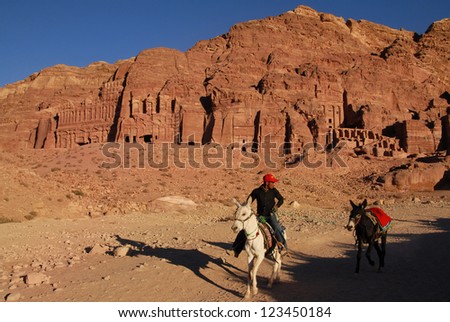 PETRA - NOV 09:Jordanian Bedouin man rides a donkey in Petra on November 09 2007.Petra was originally the capital city of the Nabataeans, an ancient Arab civilization.