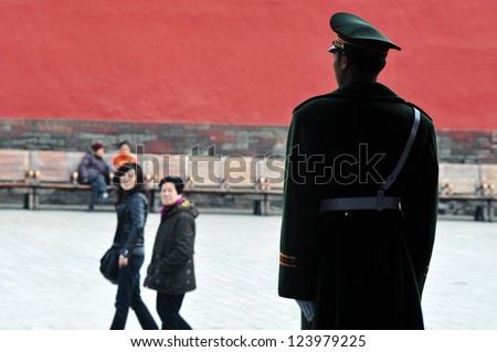 BEIJING - MARCH 11:Chinese soldier guards inside the Forbidden City on March 11 2009 in Beijing,China.Military service in China is compulsory, in theory, for all men who attain the age of 18