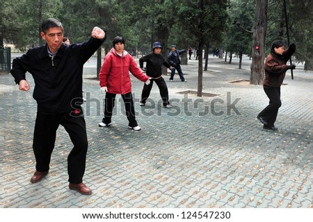 BEIJING-MARCH 15:Chinese people practice Tai Chi at The Temple of Heaven park on Mar 15 2009 in Beijing,China.It\'s the most popular park in Beijing used by thousands of people for sport and leisure.