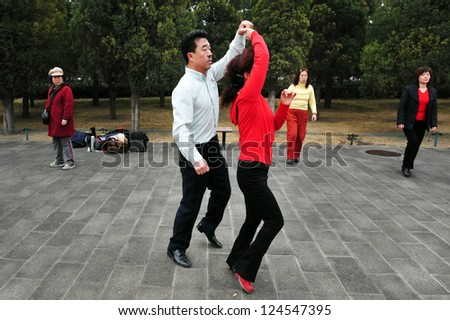 BEIJING-MARCH 15:Chinese people dancing at the temple of heaven park on Mar 15 2009 in Beijing, China.It\'s the most popular park in Beijing used by thousands of people for sport and leisure daily