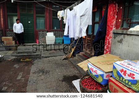 BEIJING - MARCH 12:Chinese man live in a Hutong (old neighborhood) on March 12 2009 in Beijing, China.There is around 4,000 Hutongs in Beijing some are hundreds of years old