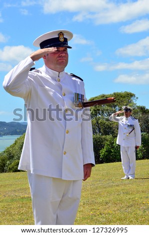 WAITANGI - FEB 6:Royal NZ Navy officers officers salute on Waitangi Day on February 6 2013 in Waitangi NZ.It\'s a New Zealand public holiday to celebrate the signing of the Treaty of Waitangi in 1840.
