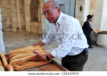 JERUSALEM - NOV 05: Arab man sale Arab pretzels at Jerusalem old city market on Novemebr 05 2010.Jerusalem is a holy city to the three major Abrahamic religions - ?Judaism, Christianity and Islam.